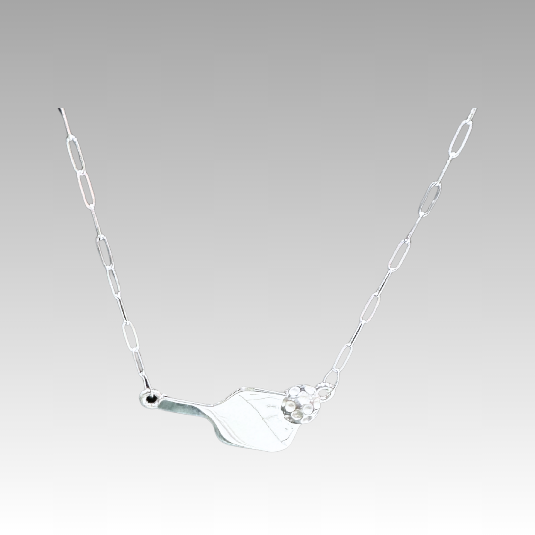 Silver necklace with a unique pendant on a light gray background