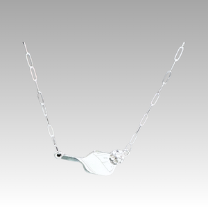 Silver necklace with a unique pendant on a light gray background