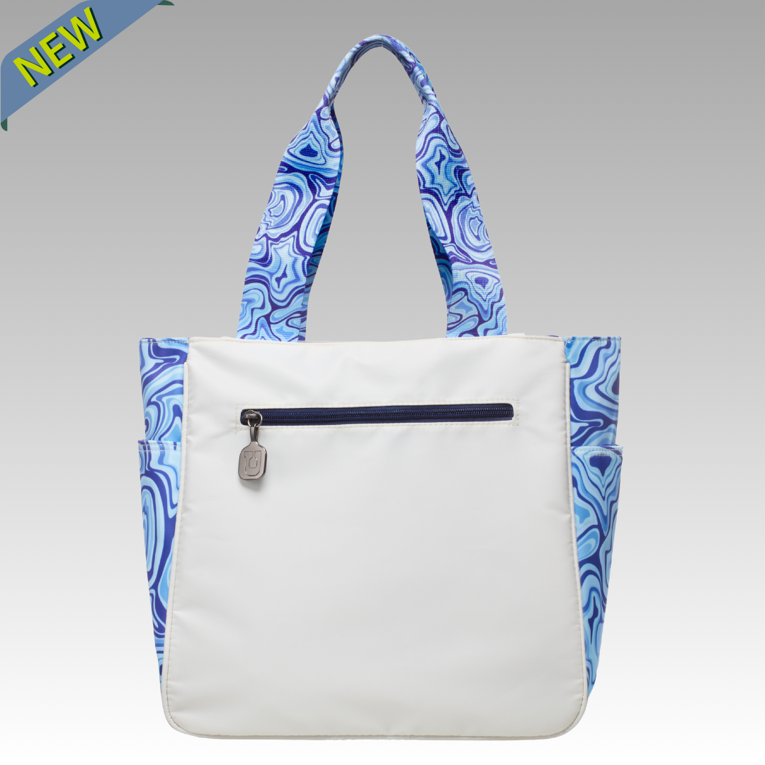 White pickleball tote bag with blue patterned handles on a gray background