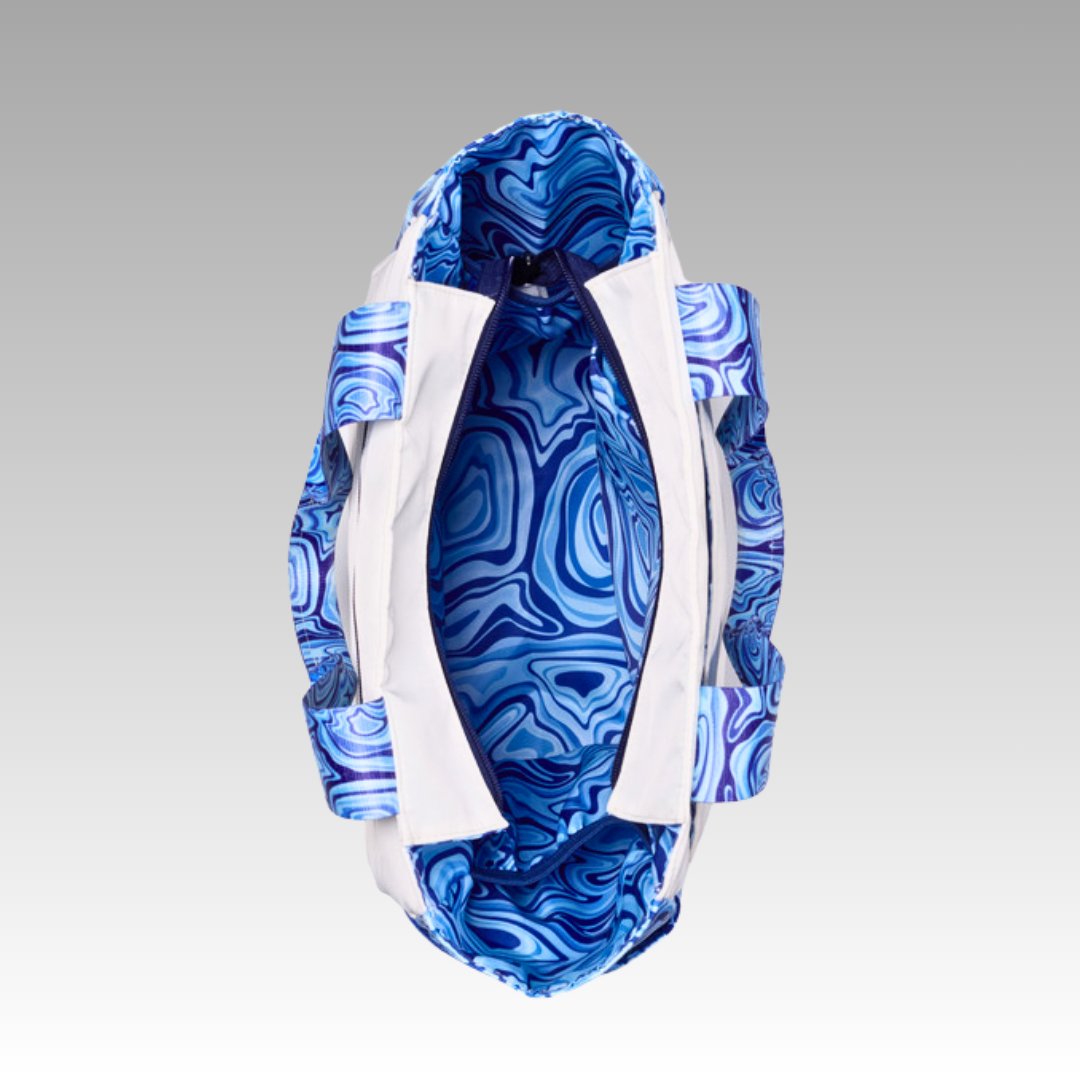 Blue marbled patterned pickleball tote with white trim on a gray background