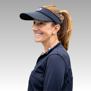 navy blue visor and dark blue shirt