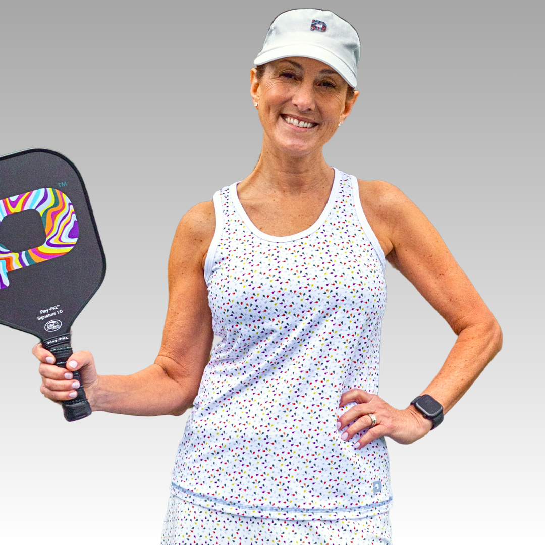 Woman holding a pickleball paddle