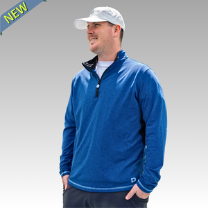 Man wearing a blue pullover with a white cap on a gray background
