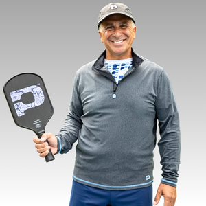 Man holding a pickleball paddle